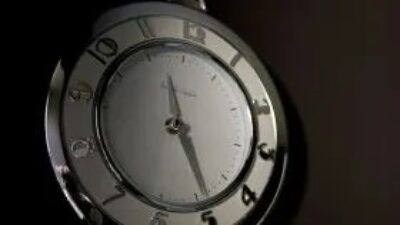 Bathroom wall clock with silver accenst