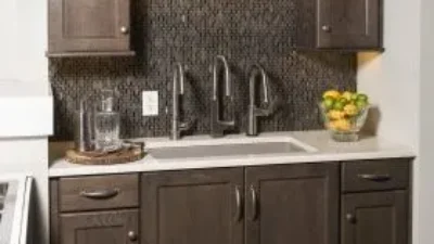 Inspirations Studio kitchen sink with dark wood cabinents