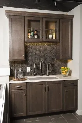 Inspirations Studio kitchen sink with dark wood cabinents