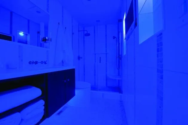 bathrrom with blue ceiling lights